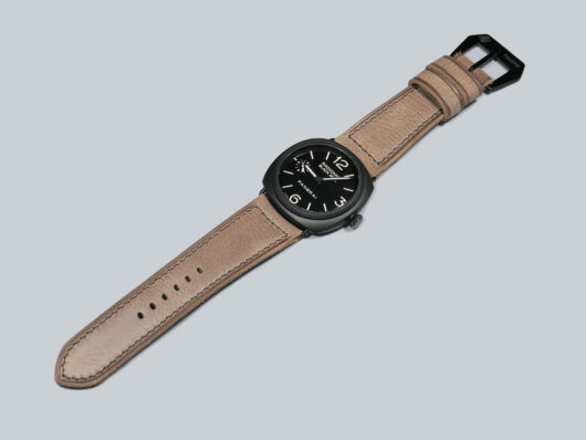 Custom Grey Panerai Radiomir Strap from Marcello Straps on a wooden surface